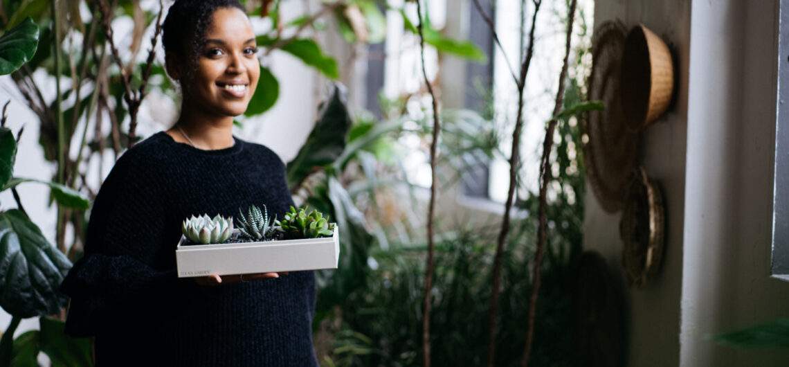 Girl holding Lula's Garden Succulents