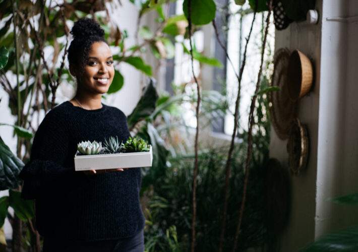 Girl holding Lula's Garden Succulents