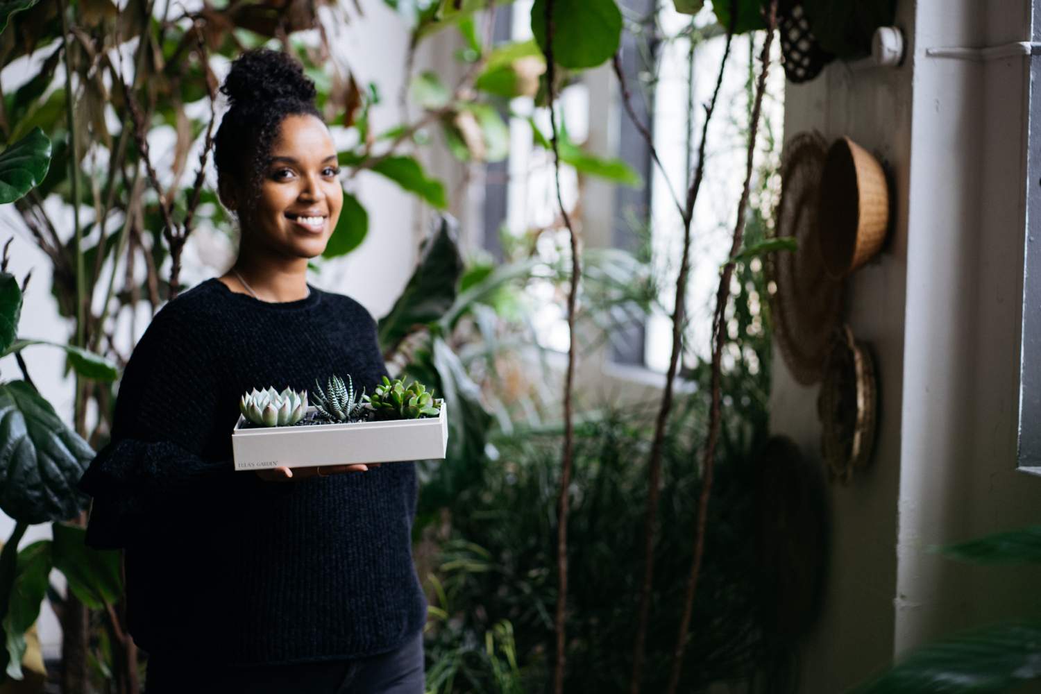 Girl holding Lula's Garden Succulents